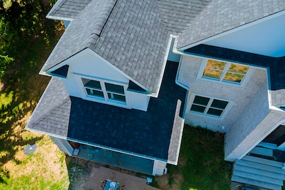 One of the seven most common roof types displayed on a newly designed modern home in the suburbs.